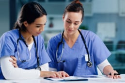 Nurses discussing in a mentor relationship.