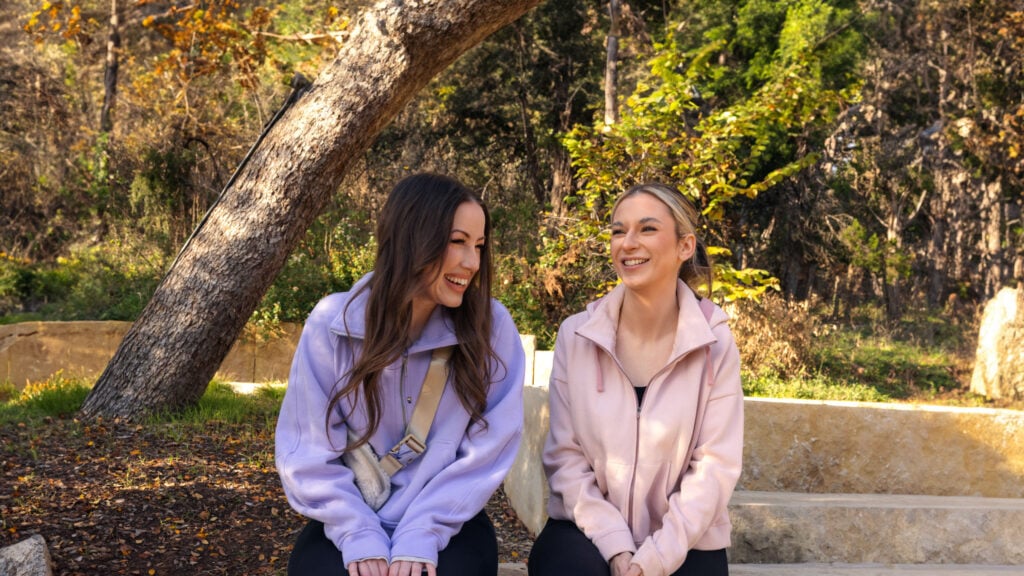 Two women in park smiling