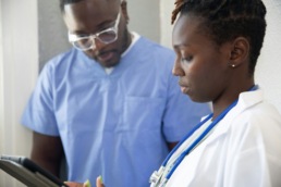 Image of doctor and nurse looking at ipad